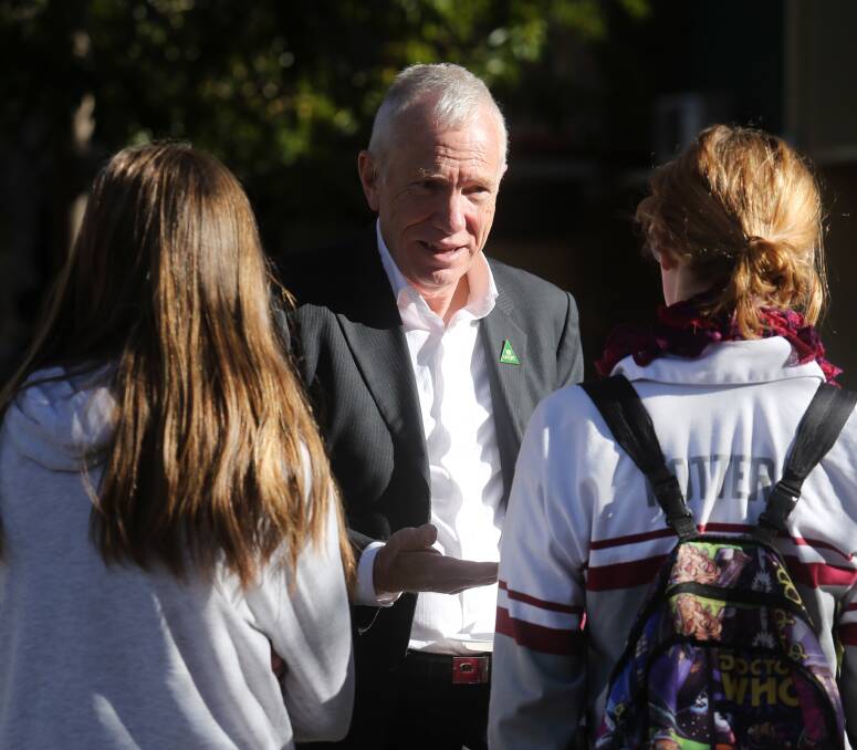 The Greens' candidate for Whitlam, Tom Hunt, chats with students at Dapto High School on Friday. The students were given the opportunity to ask candidates questions during a forum. Picture: Robert Peet