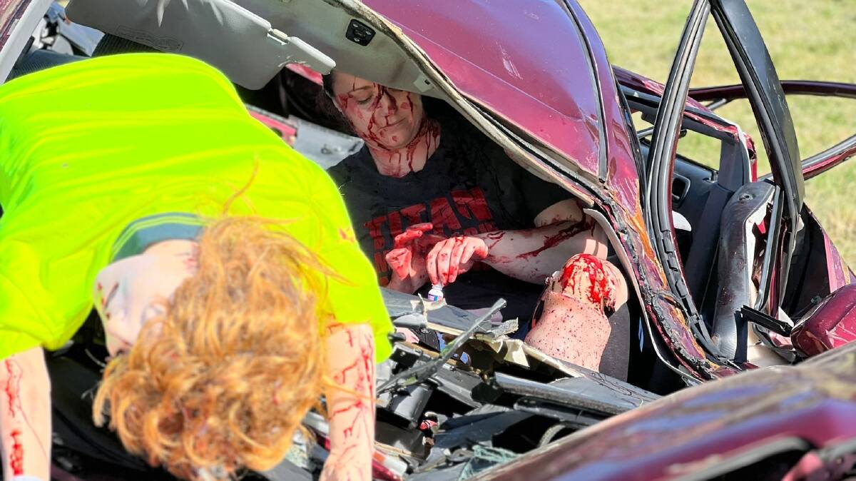 A bloodied 'victim' in the front seat of a smashed car during a trauma training session near Gerringong on Wednesday, December 6, 2023. Picture supplied