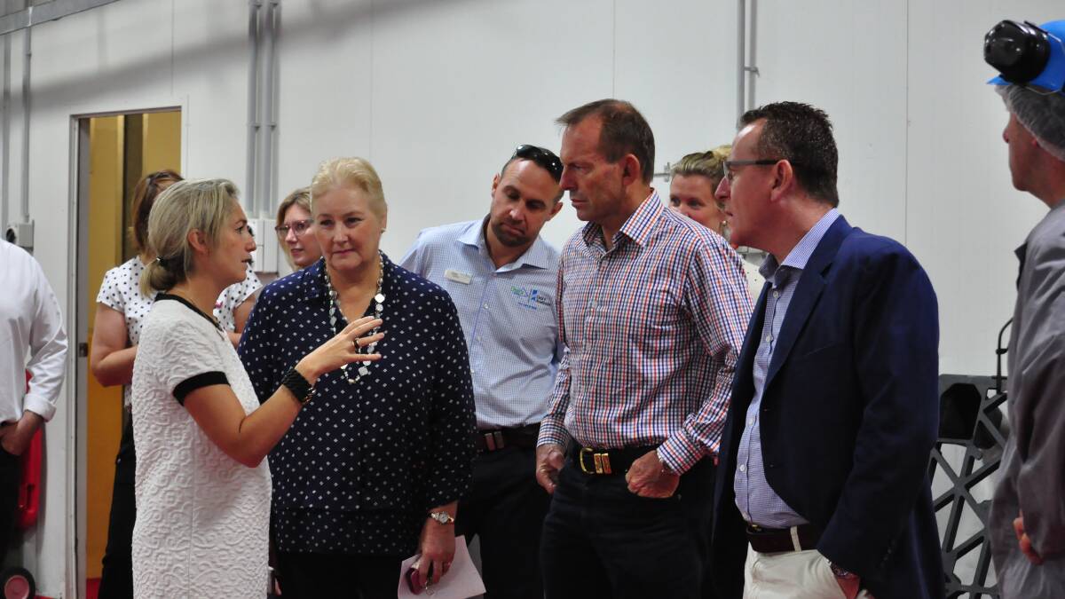 Argyle HR and Marketing director Andrina Graham shows a group of special guests around the company's Bomaderry plant on Saturday.
