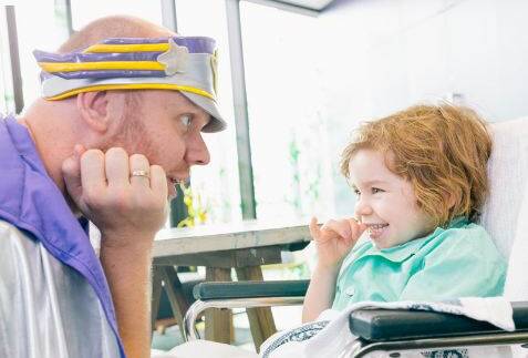 Captain Starlight and child - Photo from the Starlight Foundation