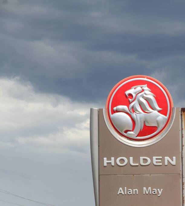 Storm clouds over the sign depicting the End is Nigh for Holdens lion