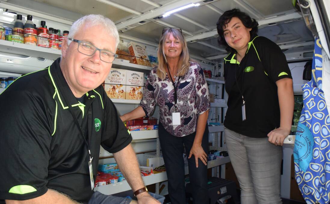 Bruce, Sharon and April from Salt get ready to help people get food to eat from the mobile response van. 