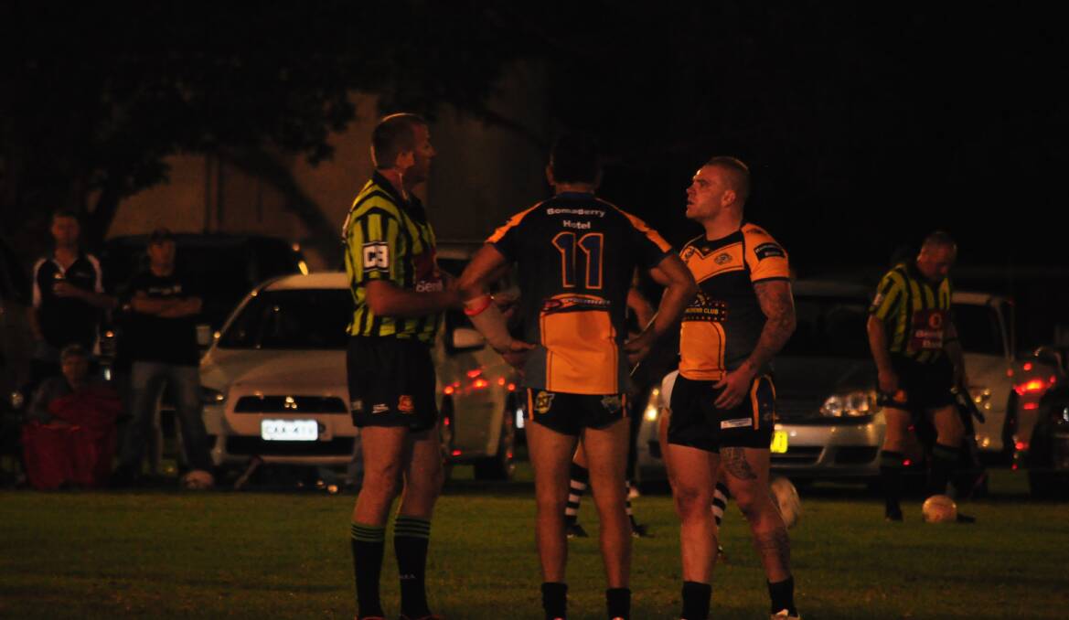 SETTLE DOWN BOYS: The referee has a few words to say to the Jets players during Saturday's local derby.