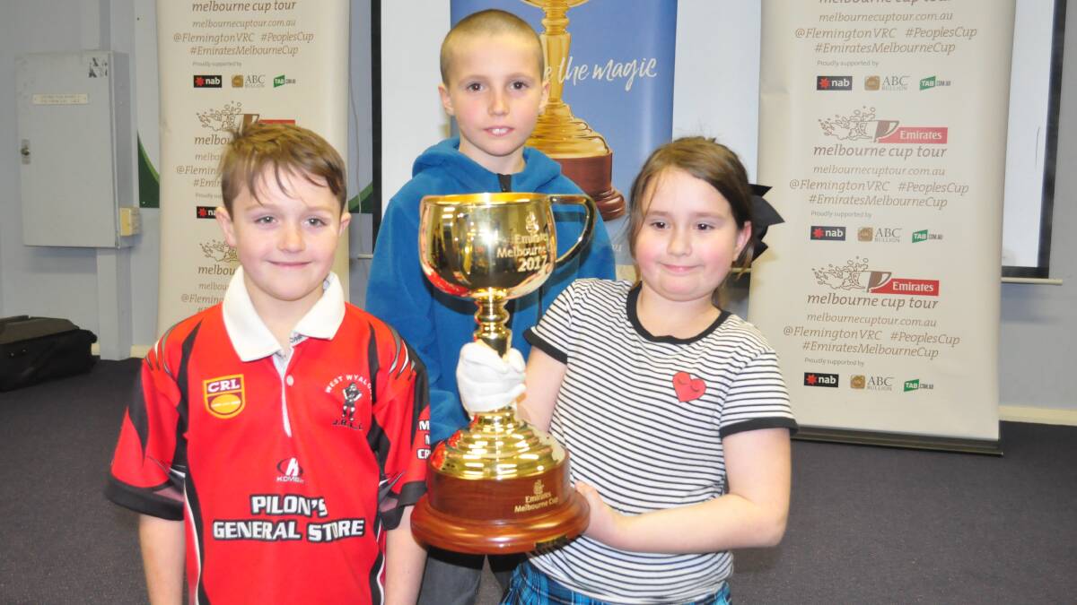 A TRIFECTA: Matthew Mallinson, (back row) Jack Fernie and  Brielle Arts with the Melbourne Cup.
