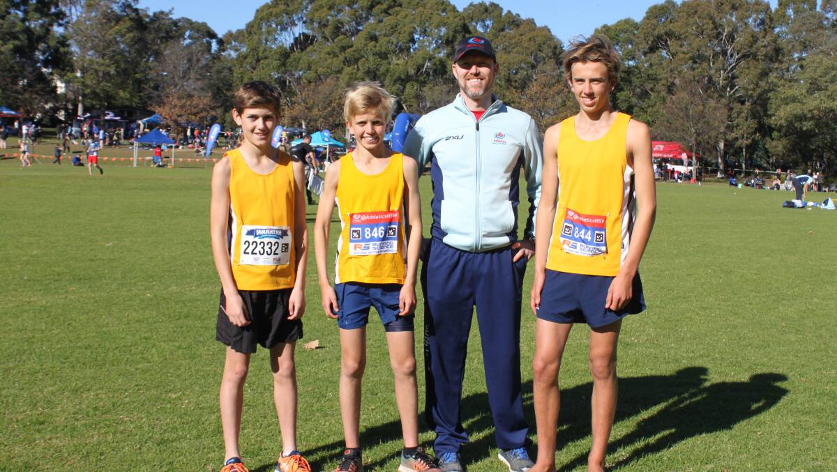 Nowra athletes Sam Maher, Alec Dobson and Hugh Dobson with Athletics NSW Chief Executive Officer Duncan Tweed.