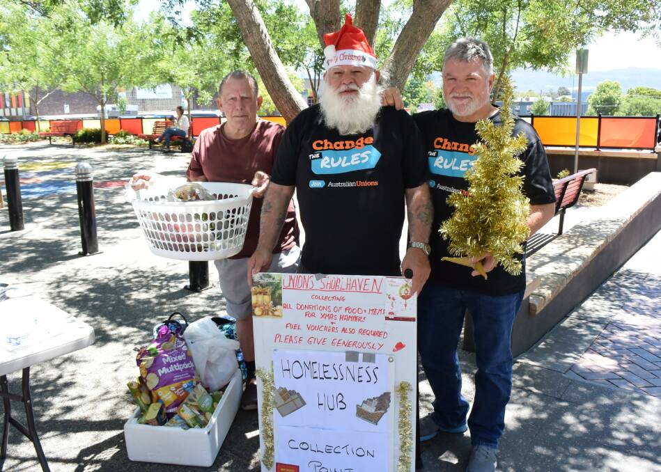 Frank Cox, Bob Hanlon and Geoff David collect goods for the homeless.