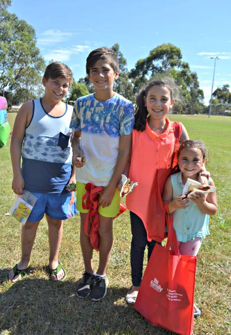 COMMUNITY CAUSE: Braxton Woods with Jett, Taaliyah and Zakaiiah Ferguson from East Nowra at last year's Prosperity in the Park Family Fun Day.