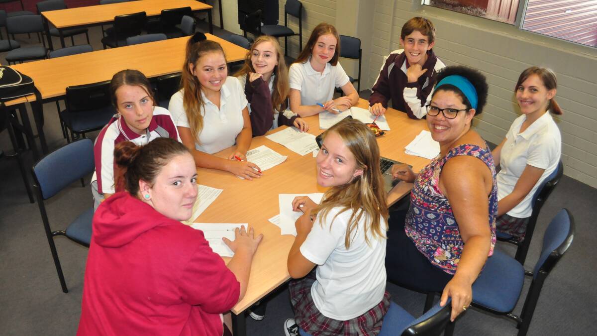 Teacher Nicole Higgins joins her Vincentia High students to work on their homelessness project.