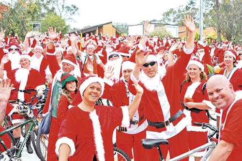 HO HO HO: Around 600 cyclists took part in the annual Vincentia to Huskisson Charity Santa Ride on Thursday evening.