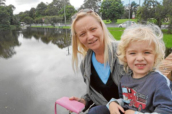INLAND LAKE: Charlene and Caleb Middleton of Bomaderry look over what used to be Thurgate Oval in Bomaderry yesterday.