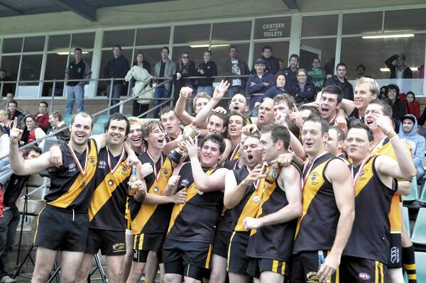 YOU BEAUTY: The Bomaderry Tigers first grade celebrate their 39-point grand final win over Uni. Photos: GREG HUTT