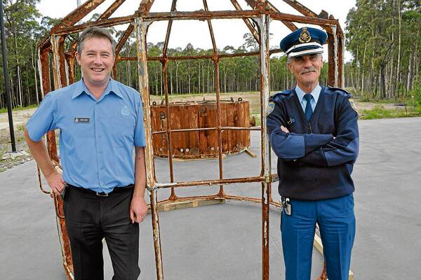 READY FOR RESTORATION: South Coast Correctional Centre business manager David Ward and South Coast Correctional Centre general manager David White pleased to have the lantern on site ready for restoration.