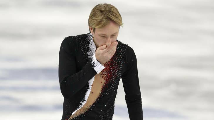 End of a career ... Russian Evgeni Plushenko leaves the ice after pulling out of the men's short program figure skating competition due to injury at the Iceberg Skating Palace. Photo: AP Photo