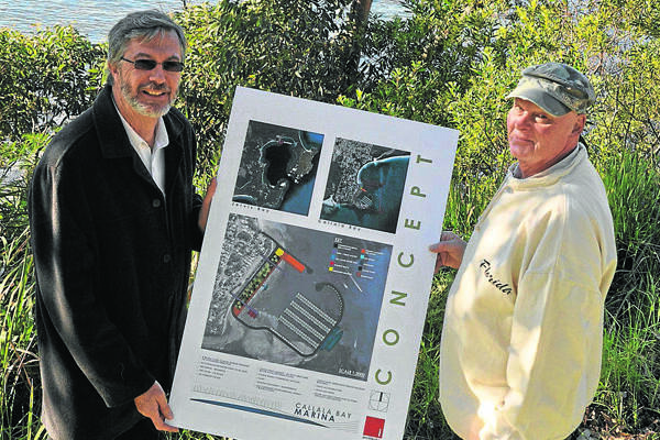MOVING FORWARD: Nowra architect Colin Irwin and Callala Marina Consultancy Group member Derek Hancock with plans of the Callala Bay Marina at the site. 