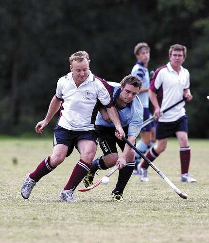 FORCE: Men’s Shoalhaven Hockey competition players David Smart and Adam Slattery battle for possession in a match earlier this season. Photo ROBERT CRAWFORD