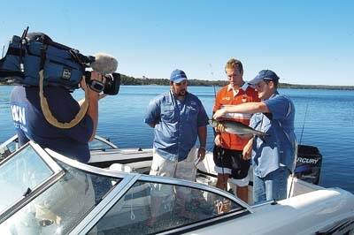ANGLING: Rob Paxevanos from Fishing Australia filming a story on St Georges Basin with local recreational angler Scott Sharpe.