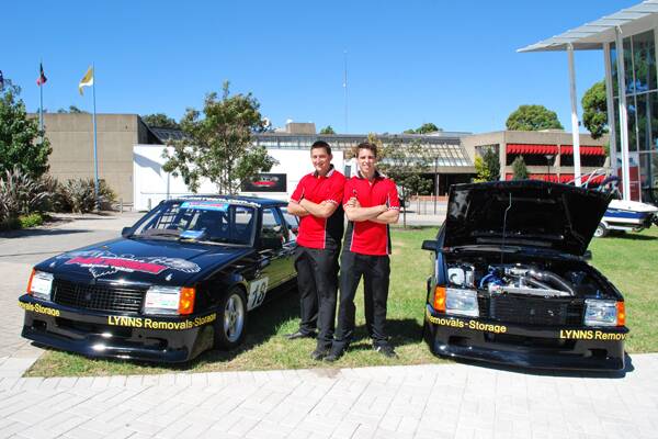 READY TO RACE: Racing brothers Ryan (left) and Reece Marchello stand proudly beside their two racing Commodores at last week’s Shoalhaven on Show expo at the Shoalhaven Entertainment Centre. The cars will hit the track for the first time this weekend.