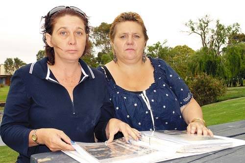 PAINFUL MEMORIES: Annette Ashfield and Audrey Golden-Brown look through clippings from the killing of six-year-old John Ashfield in Nowra 16 years ago.