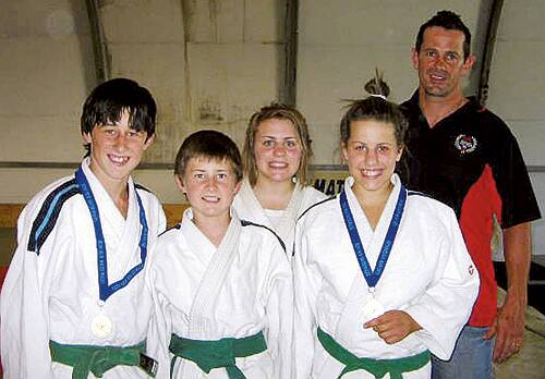 STRONG: Yuukan Judo Club coach Chris Gautier is pictured with members Blake Nolan, Luke Nolan, Hayley Jackson and Brittany Jackson who won two State gold medals.