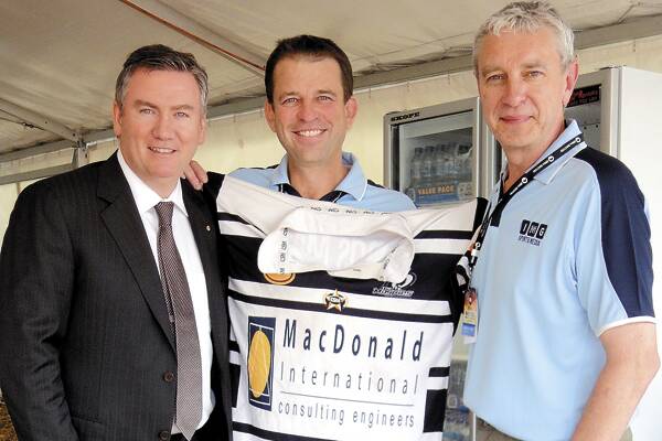NEW FANS: Former Berry local Michael O’Dwyer (centre) presented a Berry-Shoalhaven Heads rugby league jumper to Collingwood president Eddie McGuire, watched by fellow mad Magpies fan Peter Donegan.