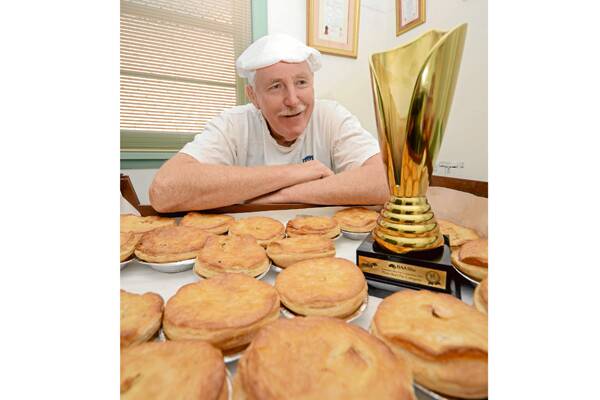 TOP PRIZE: Baker John Reminis with the gold trophy for baking Australia’s Best Plain Pie.