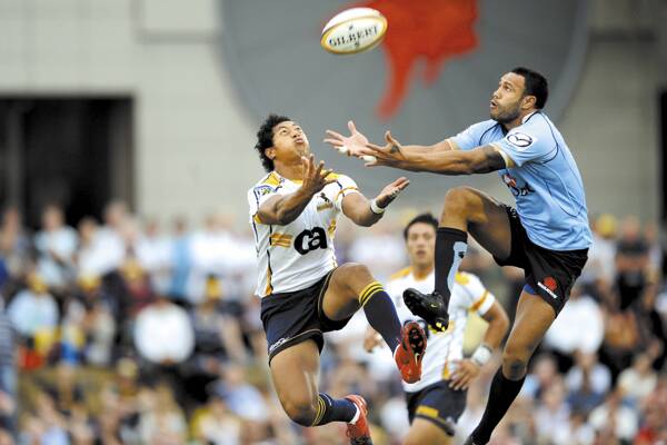 ON THE BALL: Waratah's Sosene Anesi flies high to secure possession against the ACT Brumbies.