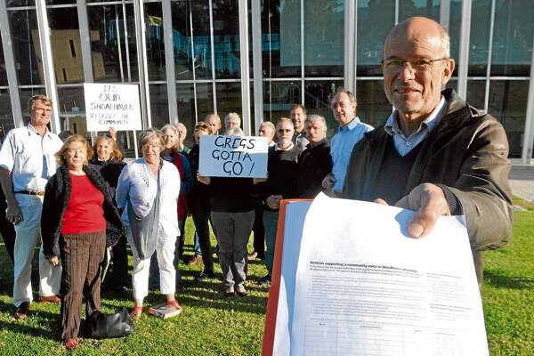 UNHAPPY: Will Armitage holds out a petition as members of the SLEP Review Group gather to voice their concerns about the LEP process.