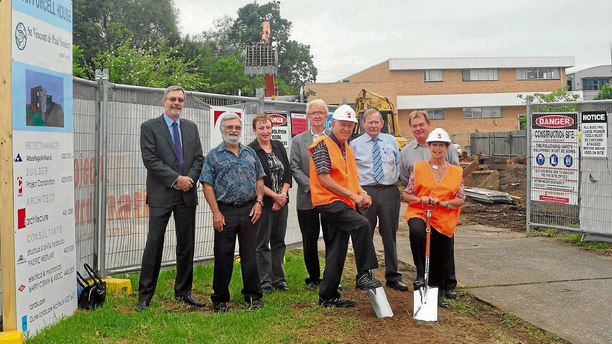 UNDER CONSTRUCTION: Former St Vincent de Paul Society Wollongong Central Council presidents Ivor Davies and Cynthia Fenemore turn the first sod for the new $3.3 million St Vincent De Paul Society’s Men’s Crisis Accommodation Centre in Nowra watched by I Architecture director Col Irwin, original John Purcell House manager Jim da Silva, St Vincent de Paul Society diocesan executive officer Debbie Nixon, St Michael’s Parish priest in Nowra, Father Pat Faherty, current hostel manager Steve Sweeney and Wollongong Diocesan Office special works co-ordinator Michael Irvine.
