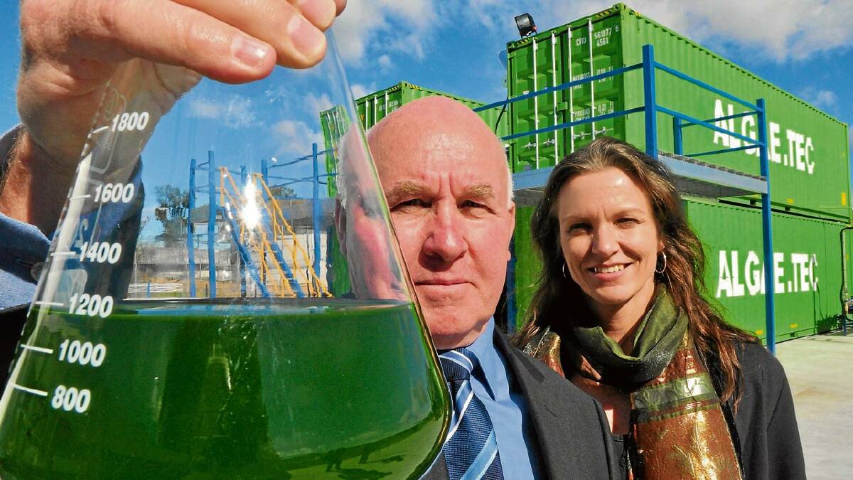 BLOOMIN’ MARVELLOUS: Algae Tec chairman Roger Stroud and head of the Shoalhaven Marine and Freshwater Centre at Wollongong University’s Shoalhaven campus, Dr Pia Winberg, with a sample of the algae that has started multiplying quickly in shipping containers on the Manildra site.
