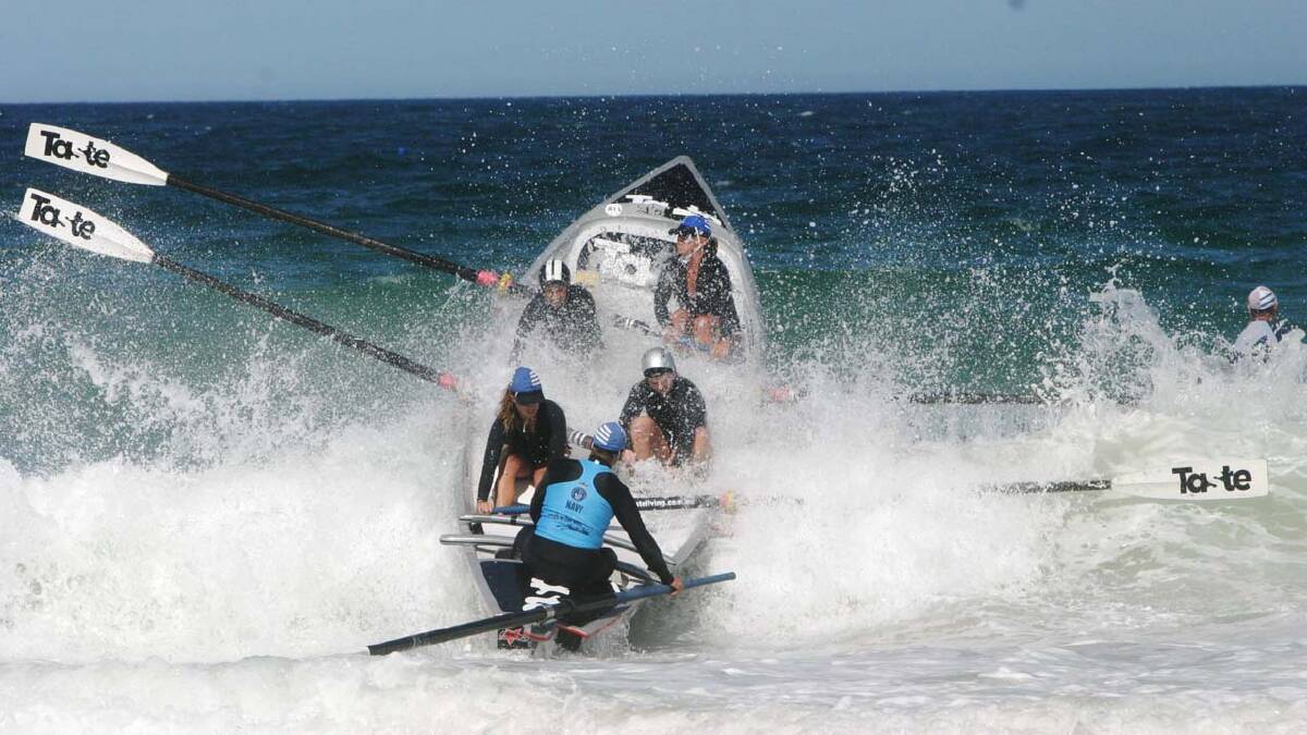 SURF’S UP: The Mollymook team battle the swell at last year’s NAVY Australian Surf Rowers League Mollymook event.