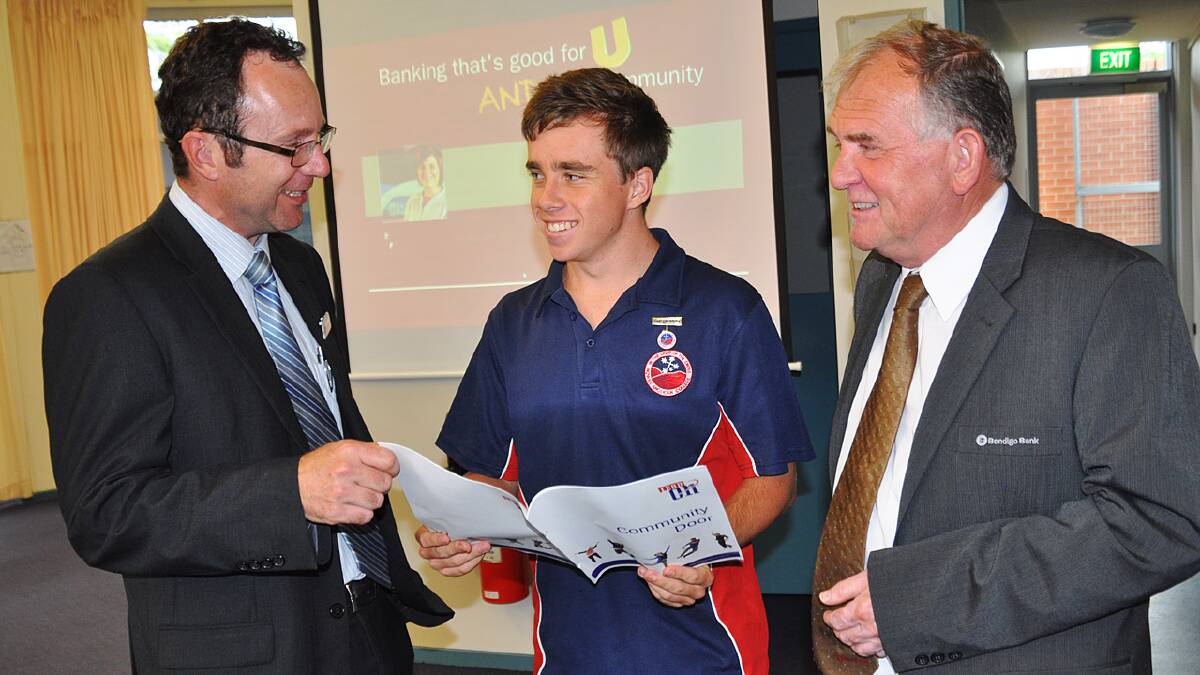 ENGAGING: Nowra Anglican College head teacher Brad Swibel with year 12 student Matt Berendsen and Nowra and District Community Bank Branch manager Steve Joy discuss the Community Door program, which gives young people the chance to gain corporate experience.
