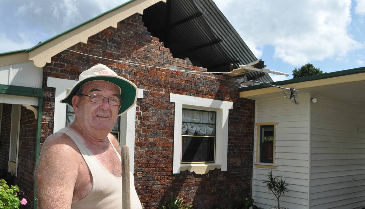 SHATTERED: Bob Gribble of Hyam Street, Nowra surveys the damage to his 100-year-old home. 