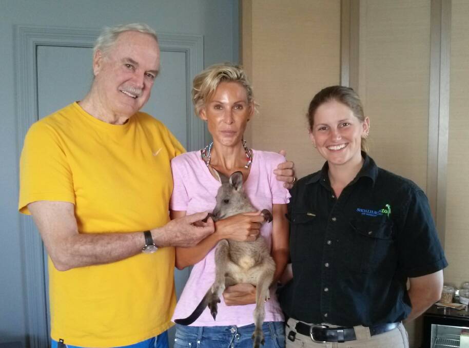 Shoalhaven Zoo senior keeper Jeni Brown with John Cleese and his wife Jennifer Wade and eight-month-old joey Honey during a special birthday visit in Sydney.