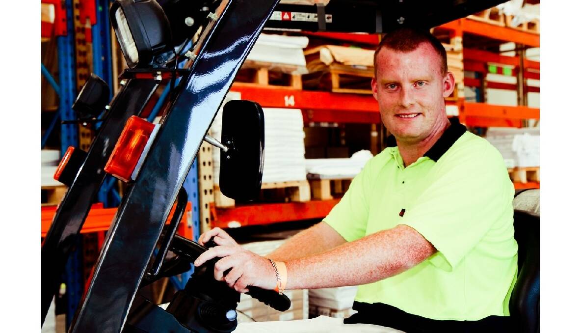 Flagstaff employee Ben Morris drives a forklift at the North Nowra site.