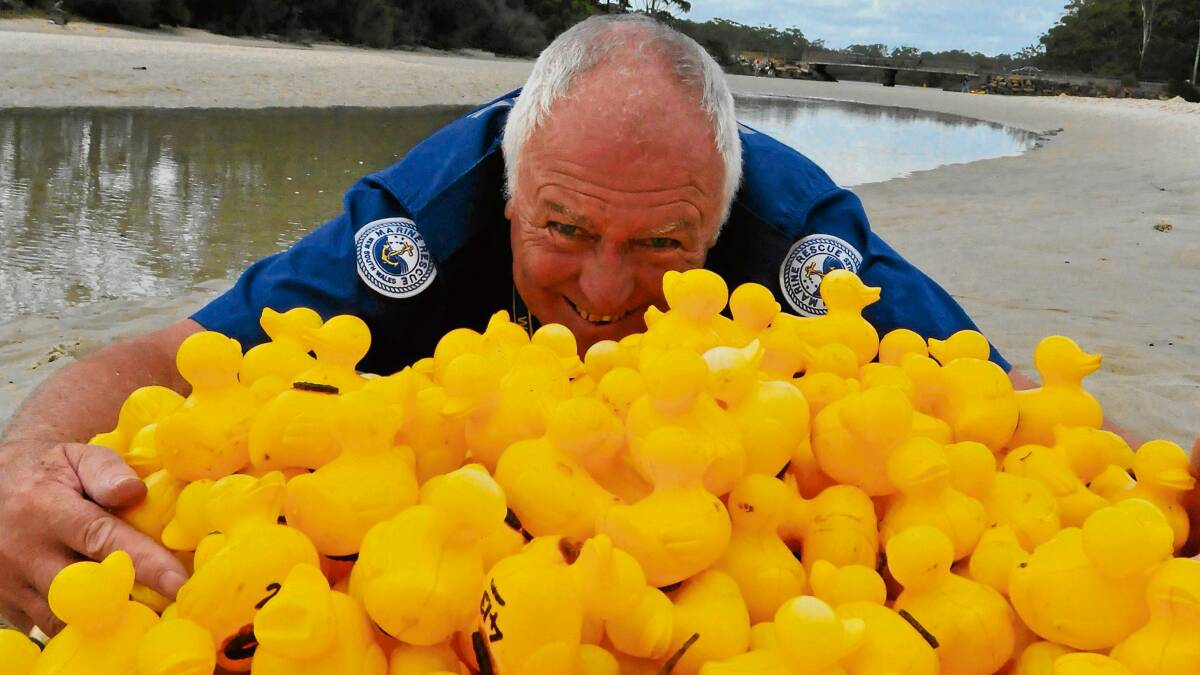 QUACK A SMILE: Volunteer with the Jervis Bay division of Marine Rescue NSW Brian Harrison gets the ducks ready for Sunday’s duck derby.