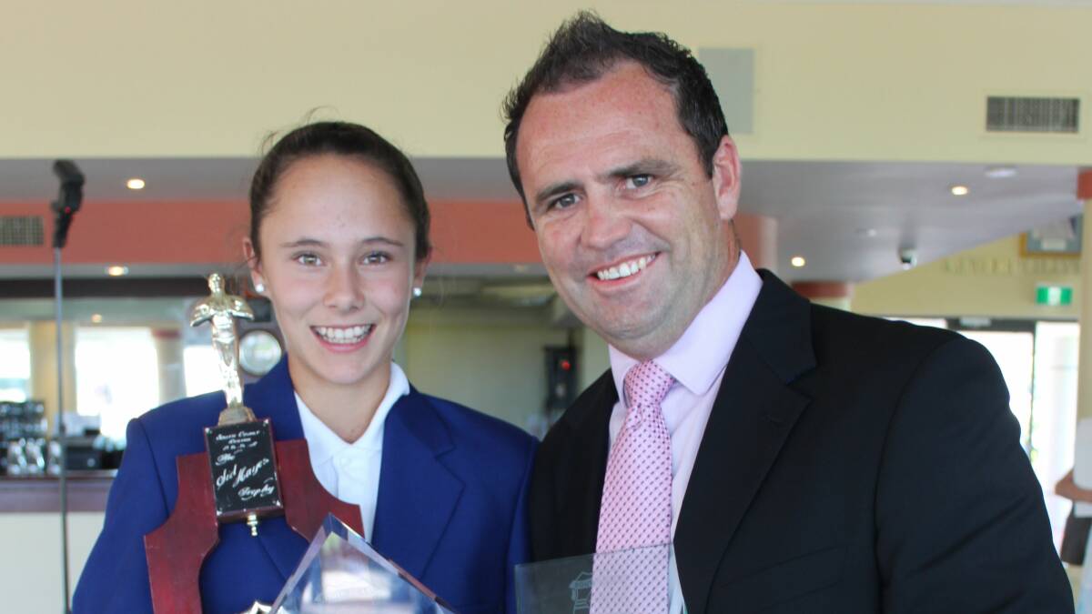 PROUD PRINCIPAL: Jade Mustapic shows off her awards with proud principal Bob Willets from Berry Public School.