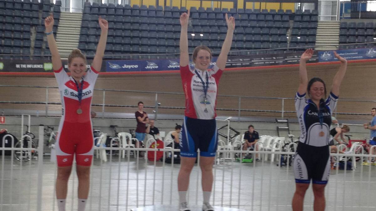SUCCESS: Bridget Mullany (centre) celebrates on the podium at the NSW u19 Track Cycling Championships.