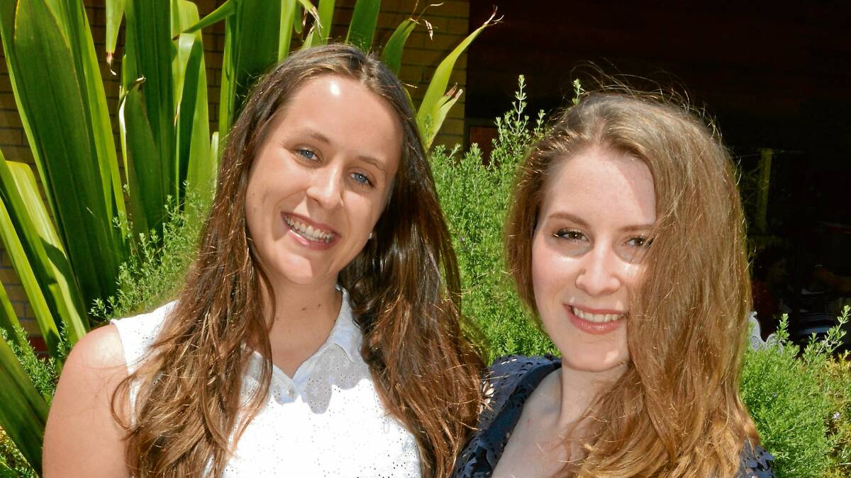 TOP ACHIEVERS: St John the Evangelist Catholic High School graduates Yvette Gilfillan and Alexis Weaver celebrate after receiving their HSC results on Thursday.