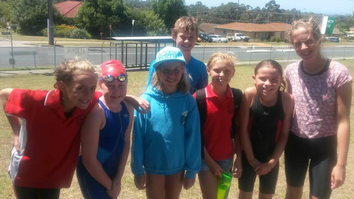 FUN IN THE SUN: Bay and Basin swimmers Tara Bellwood, Hannah Thompson, Janae Peterson, Jeremy Head, April Hawkins, Halle McKnight and Chelsie McKnight have fun at the SESA Area Championships and Speedo Sprints last weekend. 