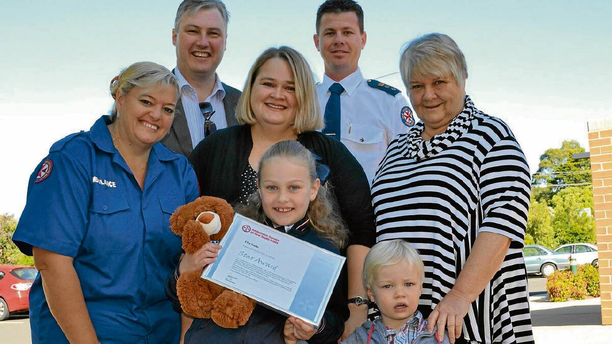 HONOURED: Nowra Anglican College student and NSW Ambulance Star Award recipient Elsa Guile with her proud parents Andrew and Natalie, younger brother Ollie, and grandmother Colleen Edwards with Southern Control call taker Janelle Gaskin and NSW Ambulance Chief Superintendent Joel Bardsley.