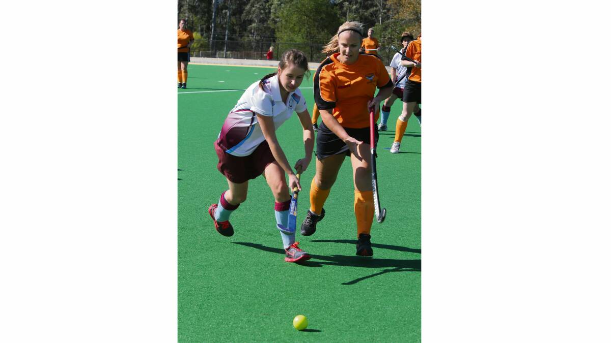 GREAT CHASE: Shoalhaven Heads’ Danielle Hennings chases the ball with Allsorts’ Toby Bacchus in Allsorts’ 4-nil win last weekend.  	Photo: ROB CRAWFORD