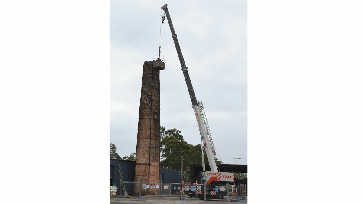 BRICK BY BRICK: Port Kembla company Tolco demolishes by hand a South Nowra landmark, the 20-metre brick chimney at the old Nowra Brickworks site.