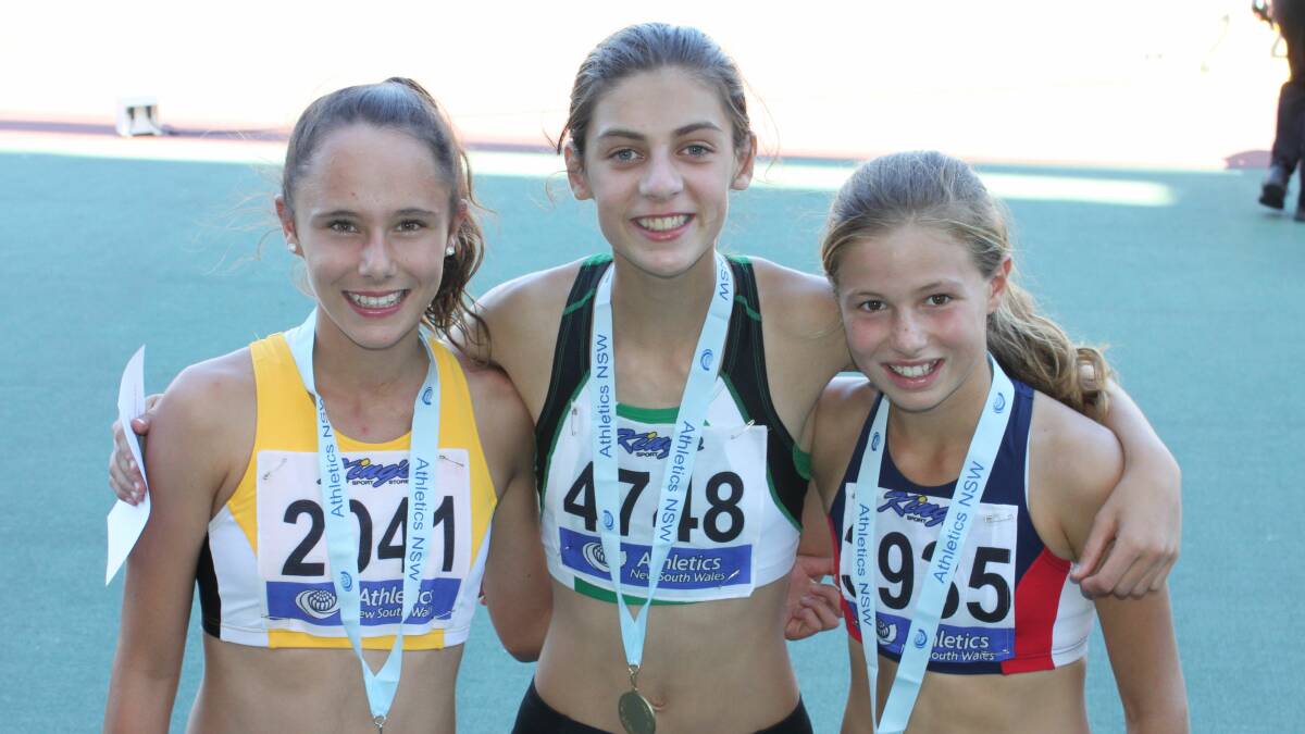 SILVER SISTER: Jade Mustapic (left) celebrates the silver medal she won in the u14 400 metres at the NSW Junior Championships in Sydney last weekend with the first and second place getters.