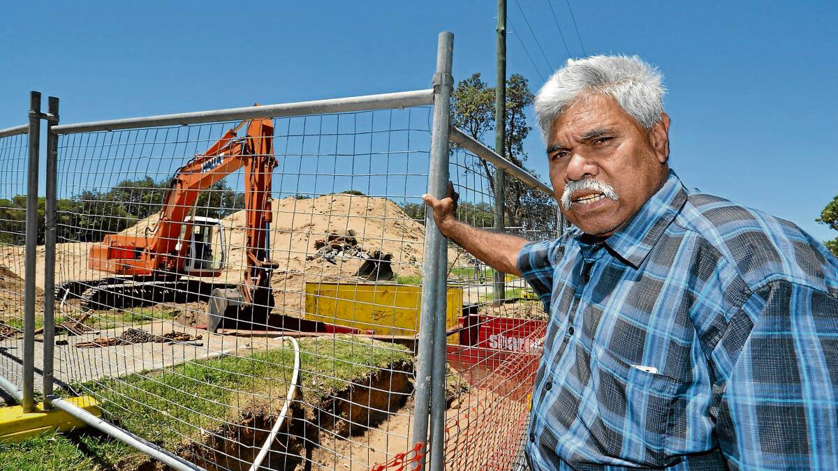 PROTEST: Aboriginal elder Graeme Connolly stopped work at a Shoalhaven Heads development site yesterday to highlight the need to protect significant sites.