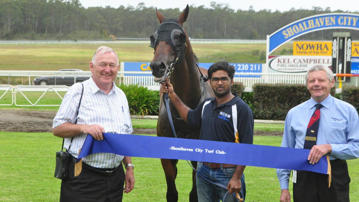 SPECIAL GUEST PRESENTATION: Racing legend Ken Callander was a special guest at Monday’s meeting, where he presented the winner’s ribbon to Pump It, along with Shoalhaven City Turf Club vice-chairman Ian Whitby. 	Photo: PATRICK FAHY