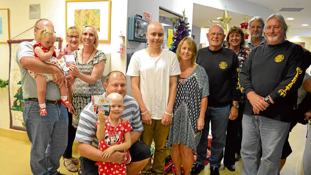 SUPPORT: Three of the seven families in need of support received their donated fuel and grocery vouchers from Bike Riders and Tourers of the Illawarra and Shoalhaven members Bruce, Sharon, Bill and Steve at the Shoalhaven Hospital children’s ward on the Monday before Christmas. 