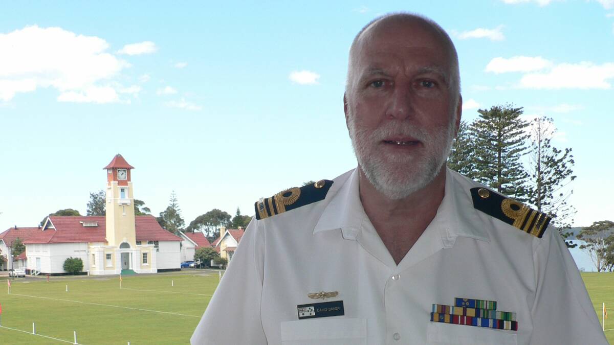 SIGNING OFF: Lieutenant Commander David Baker on his day of retirement at HMAS Creswell. Photo: CHLOE WOOTTEN