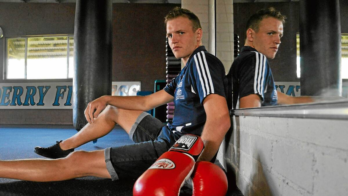 QUALIFIED: Bomaderry boxer Mark Lucas chills out at his local gym after securing a state championship. 		 	Photo: GILLIAN LETT