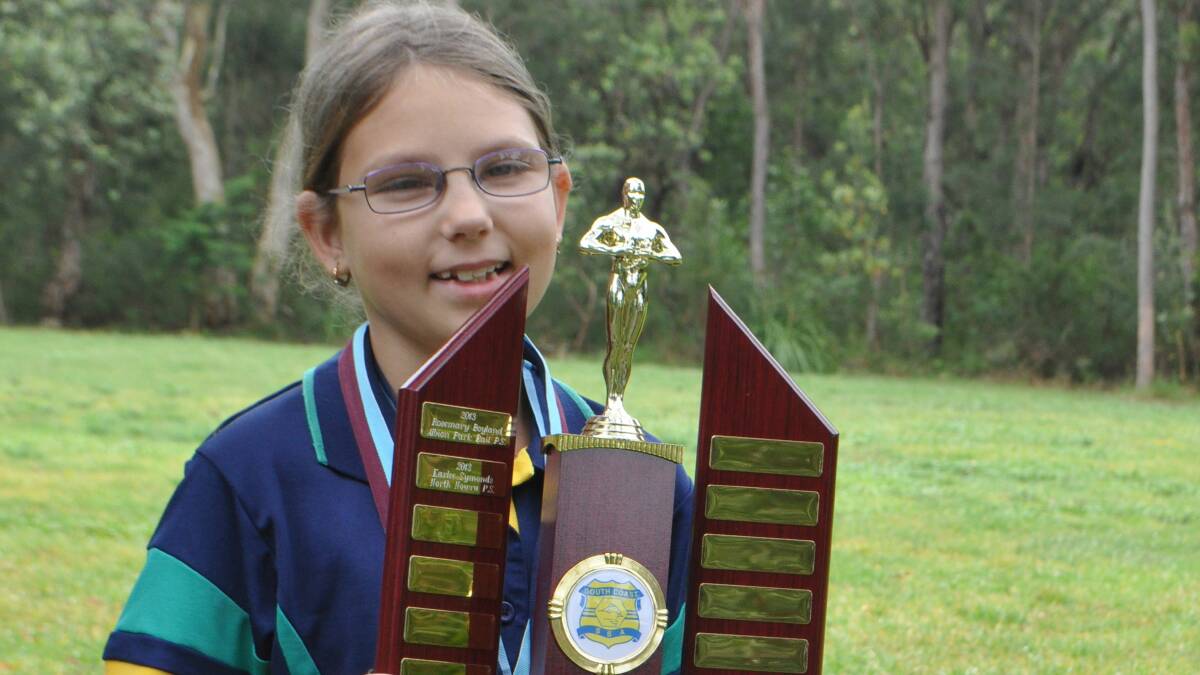 SHE’S THE FASTEST: North Nowra Public’s Karlee Symonds shows off her award for Most Outstanding AWD Athlete in primary School.  	Photo: PATRICK FAHY  
