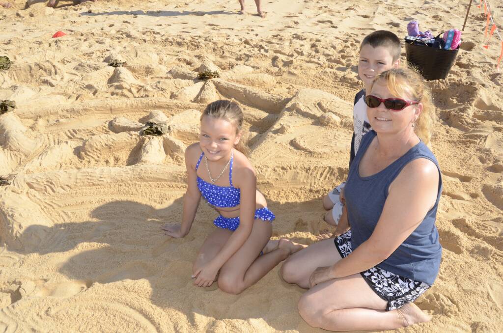 FUN IN THE SUN: Pictured at Sand Art 2014 held on Culburra Beach on Saturday, Haley, Kerry and Jaiden Merrick from Culburra